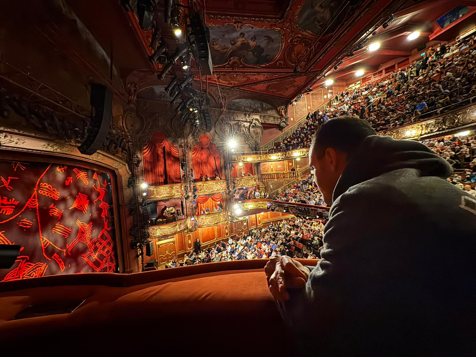 Man watching a Musical at the theatre.